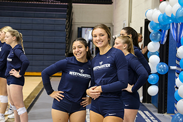 student athletes posing in a gymnasium